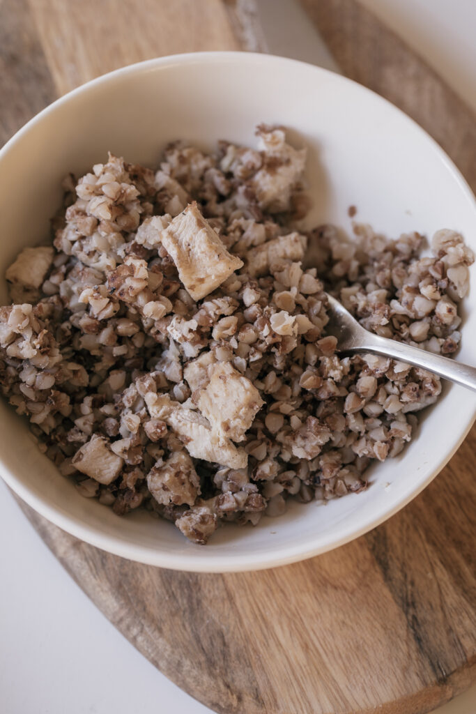buckwheat with chicken in white bowl